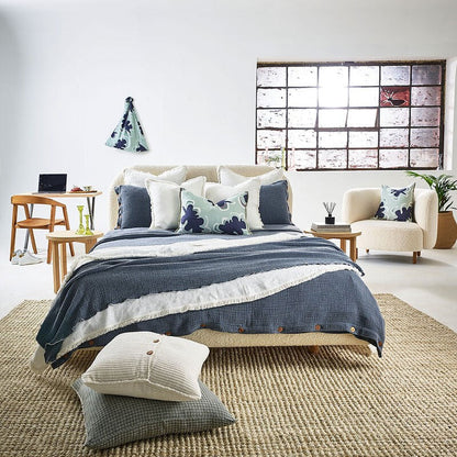 steel blue duvet set with contrast stitching, lettuce edge and wooden button feature