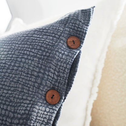 steel blue duvet set with contrast stitching, lettuce edge and wooden button feature