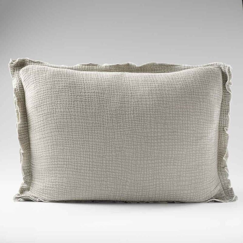 pistachio coloured cushion in a soft fabric with a double flange design and contrast stitching detail