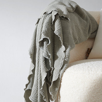 pistachio throw lettuce edge trim and contrast stitching feature