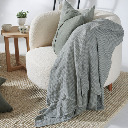 houndstooth pattern linen throw in pistachio with frayed edge feature