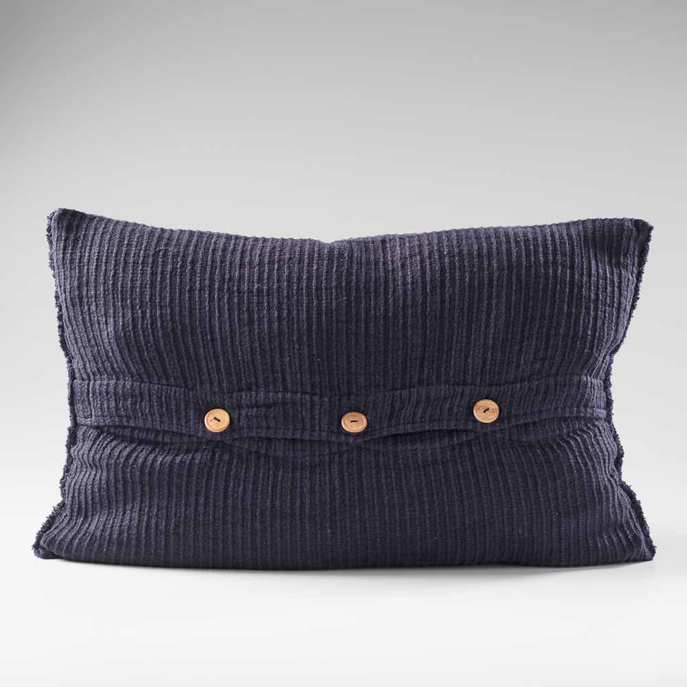 navy blue ribbed linen cushion with wooden button closure feature and frayed edging