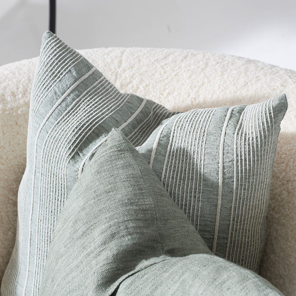 pistachio linen cushion with a white stripe feature 