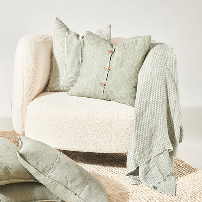 pistachio linen cushion with wooden button feature