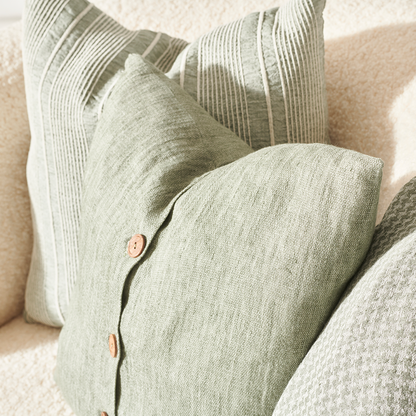 pistachio linen cushion with wooden button feature
