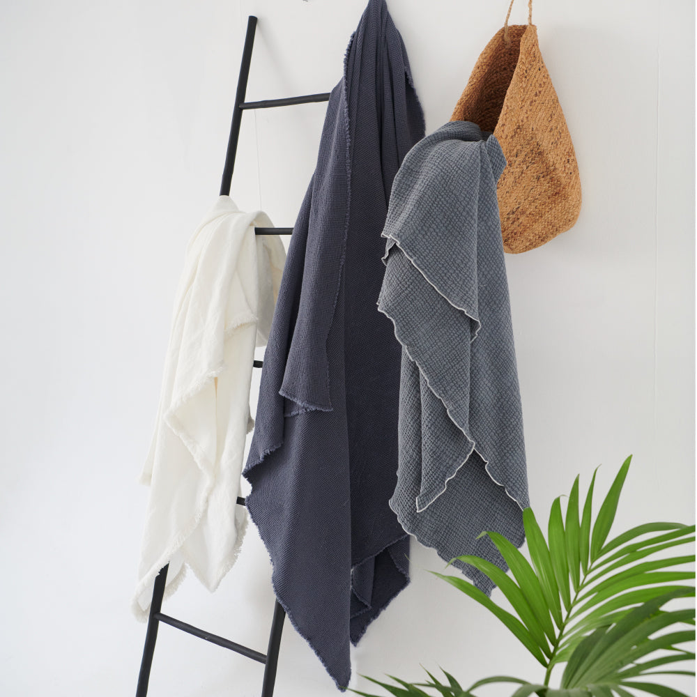 steel blue throw lettuce edge trim and contrast stitching feature