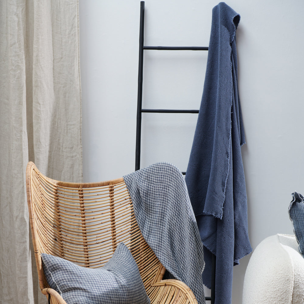 cotton waffle textured throw in navy blue with frayed edge