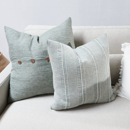 pistachio linen cushion with a white stripe feature 