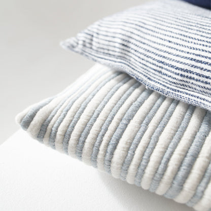 blue and white stripped cushion in a soft ribbed material
