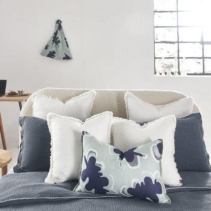 100% linen cushion in a sea mist and navy leaf abstract pattern and a contrast stitch feature