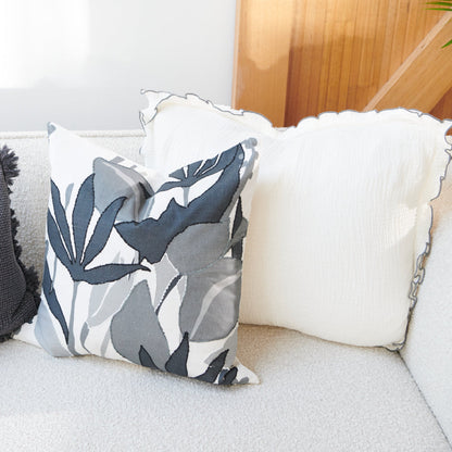 white coloured cushion in a soft fabric with a double flange design and contrast stitching detail